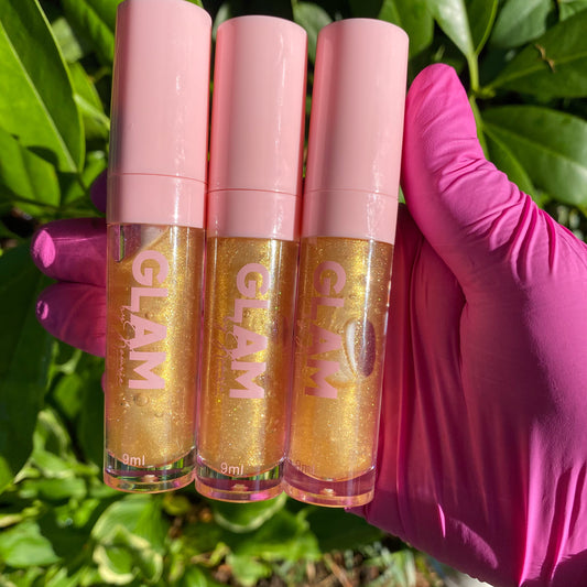 Luxury lip gloss is a gold shimmer lip gloss that applies shimmery. 